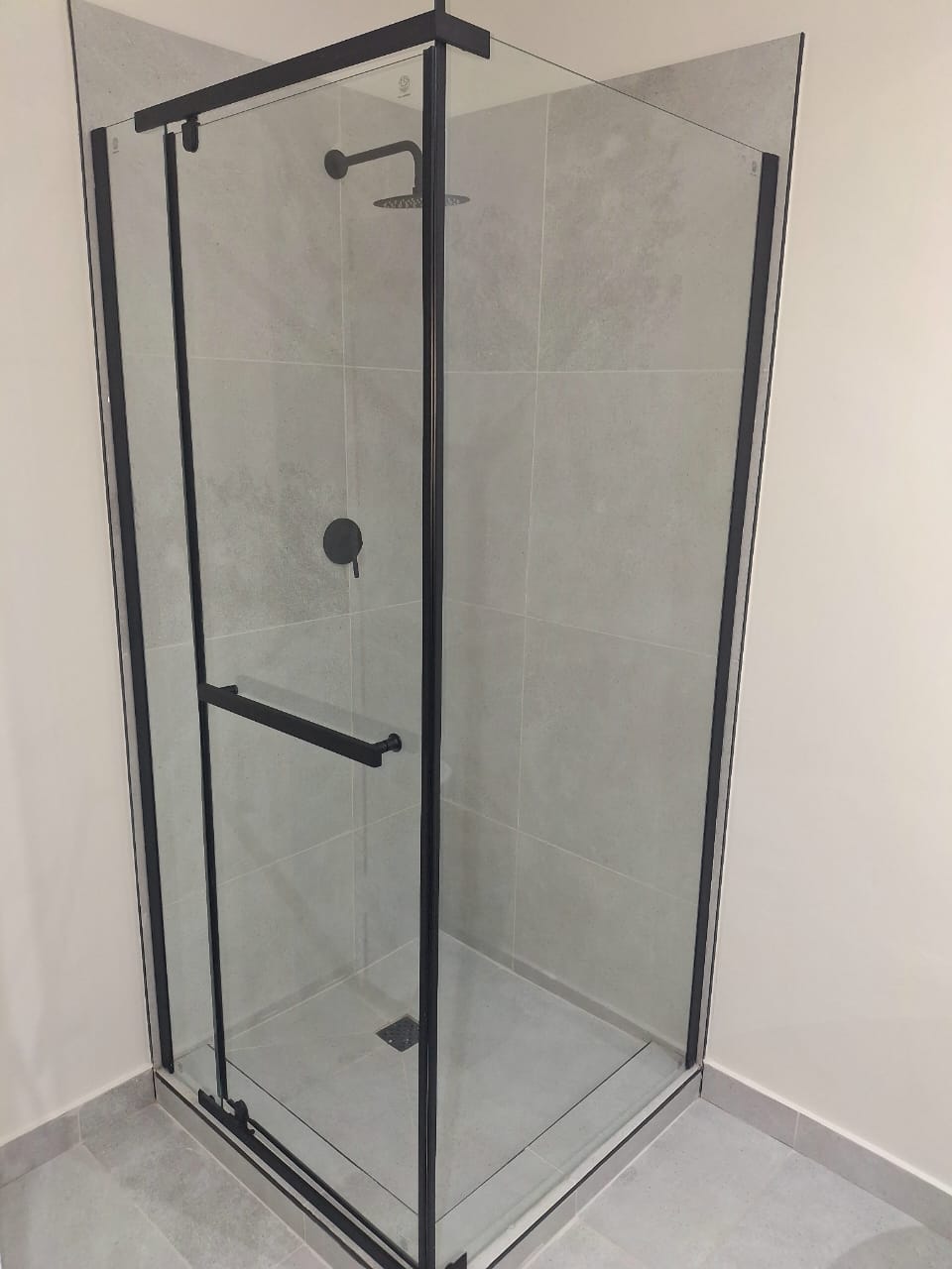Modern Durban bathroom renovation with freestanding bath, black fittings and walk-in shower