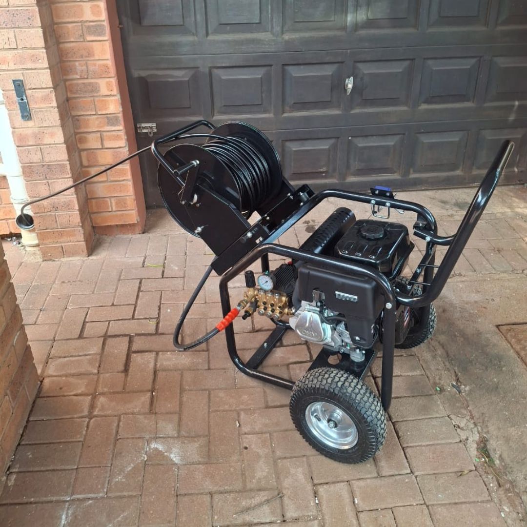 High-pressure water jetting hose clearing a blocked drain in Durban